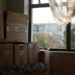Unpacked moving boxes by the window